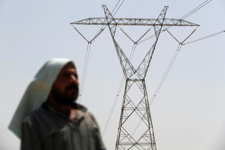 Ligne à haute tension près de Hilla, dans le centre de l'Irak, le 10 août 2025 ( AFP / AHMAD AL-RUBAYE )