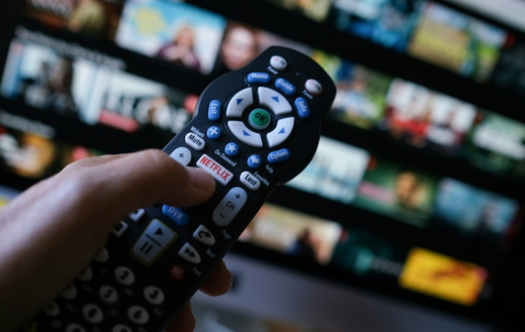 Malgré une croissance ininterrompue, Netflix enregistre un coup de frein à sa rentabilité ( AFP / Chris DELMAS )