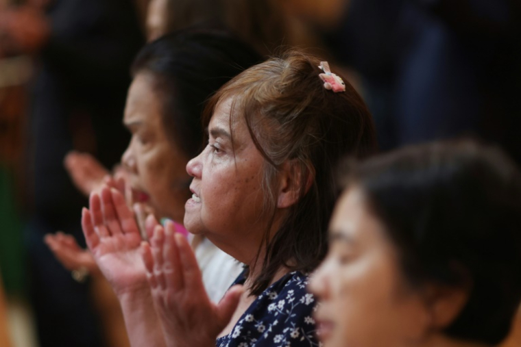 Des fidèles à Los Angeles, en Californie, le 8 mai 2025 ( AFP / David Swanson )