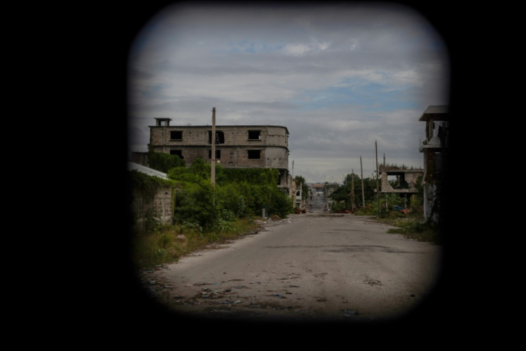 Une rue déserte vue depuis une voiture de patrouille à Port-au-Prince, en Haïti, le 16 janvier 2026 ( AFP / Clarens SIFFROY )