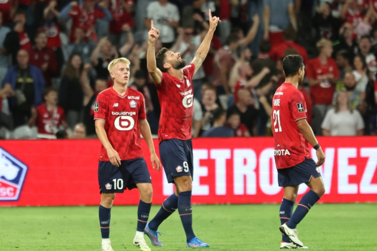 Le Français Olivier Giroud célèbre son but lors du match de Ligue 1 entre Lille et Monaco au stade Pierre-Mauroy de Villeneuve-d'Ascq le 24 août 2025 ( AFP / FRANCOIS LO PRESTI )