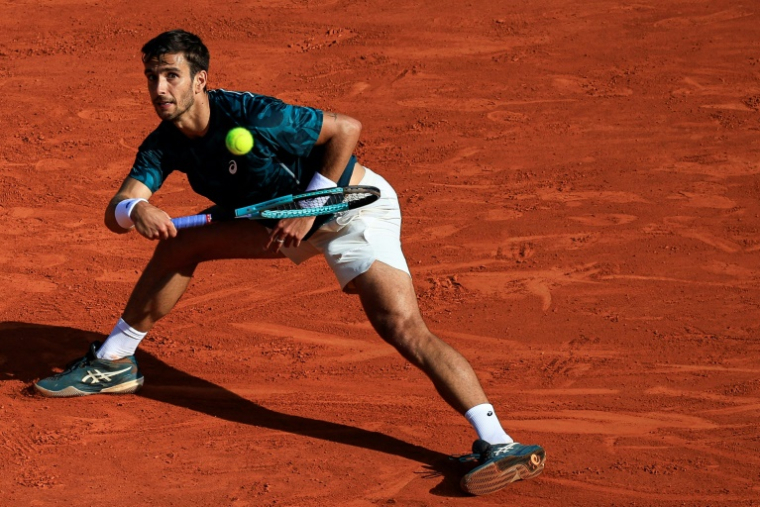Lorenzo Musetti face à Stefanos Tsitsipas à Monte-Carlo, le 11 avril 2025 ( AFP / Valery HACHE )