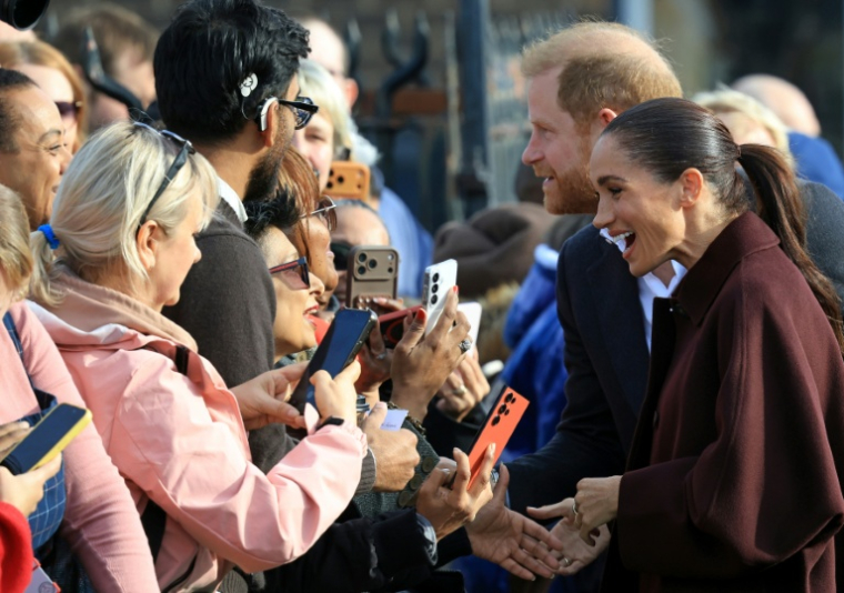 Le prince Harry et son épouse Meghan, duc et duchesse de Sussex, lors d’une visite à Nottingham, le 15 octobre 2026 dans le centre de l’Angleterre ( AFP / Darren Staples )