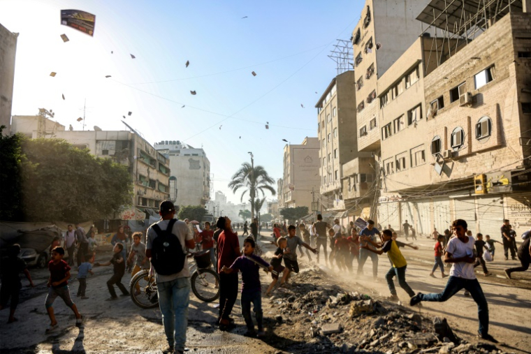 In Gaza City, Israeli army leaflets rained down on Palestinians ordering them to evacuate ( AFP / Omar AL-QATTAA )