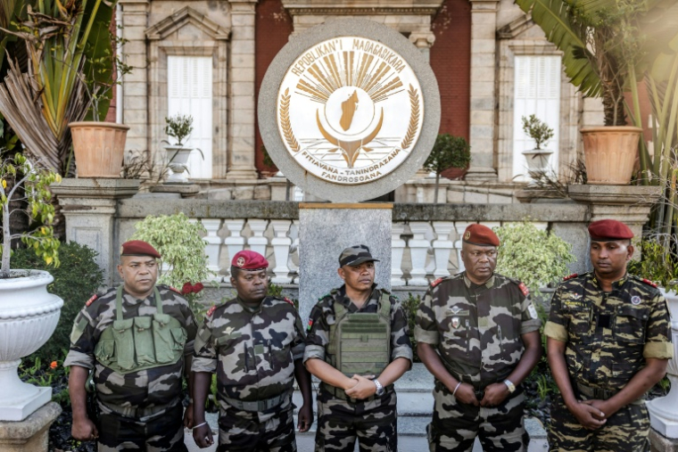 Colonel Michael Randrianirina (C) has pledged to lead the impoverished Indian Ocean island to civilian leadership in under two years ( AFP / Luis TATO )