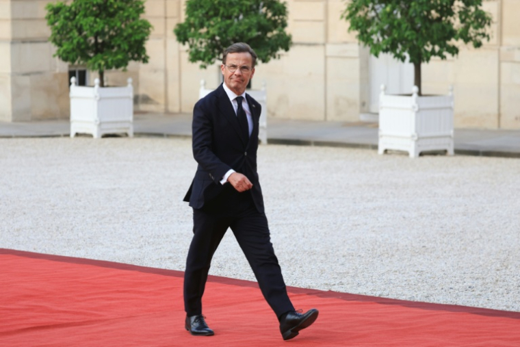 Le Premier ministre suédois Ulf Kristersson arrive au palais de l'Elysée pour un dîner de la "coalition des volontaires" en faveur de l'Ukraine, le 13 juillet 2026 à Paris  ( AFP / Ludovic MARIN )