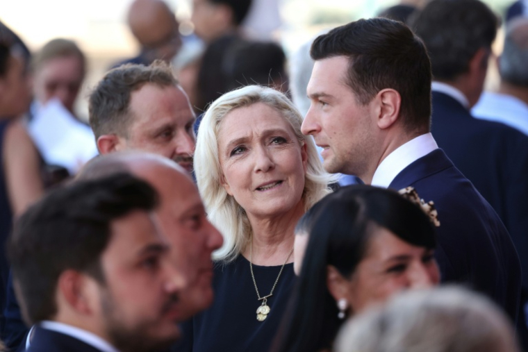 Marine Le Pen (G) et Jordan Bardella (D) lors de l'hommage solennel aux victimes et aux héros de l'attentat du 14 Juillet 2016 à Nice le 14 juillet 2026 ( AFP / Valery HACHE )