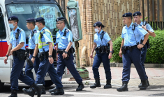 Des policiers à Hong Kong, le 22 août 2023. ( AFP / PETER PARKS )