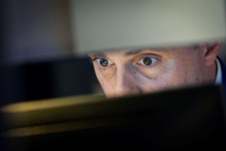 Des traders travaillent sur le parquet du NYSE à New York