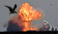 The SpaceX Starship SN9 explodes into a fireball after its high altitude test flight from test facilities in Boca Chica