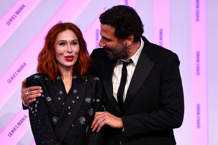 Les deux principaux acteurs de HPI Audrey Fleurot, qui interprète Morgane Alvaro, et Mehdi Nebbou (Adam Karadec) à Lille le 28 mars 2025 ( AFP / Sameer Al-Doumy )