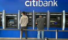 FILE PHOTO: Customers use ATMs at Citibank branch in New York City