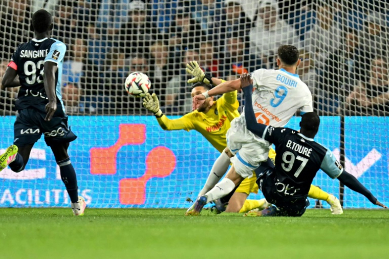 L'attaquant algérien de Marseille Amine Gouiri marque le premier but de l'OM au Havre samedi, lors de la 33e journée de Ligue 1. ( AFP / Lou BENOIST )