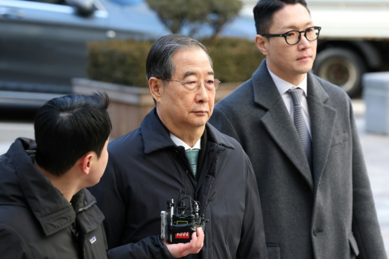 L'ancien Premier ministre sud-coréen Han Duck-soo arrive au tribunal central de Séoul, le 21 janvier 2026 ( POOL / Chung Sung-Jun )