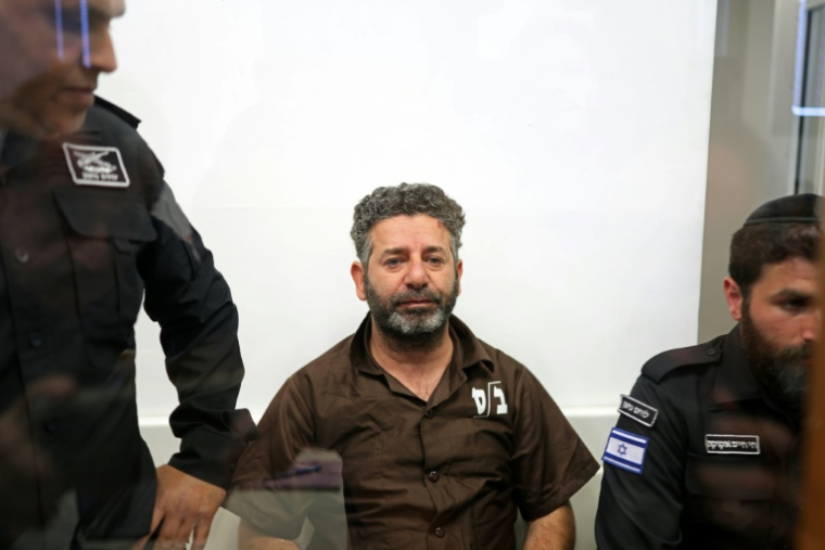 L'Espagnol Saif Abu Keshek, militant de la "Flottille pour Gaza", le 3 mai 2026 à son arrivée au tribunal de la ville côtière israélienne d'Ashkelon ( AFP / Ilia YEFIMOVICH )
