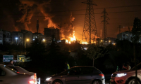 Une frappe aérienne israélienne a visé le dépôt de carburant de Shahran, dans le nord-ouest de Téhéran, le 15 juin 2025 ( AFP / Atta KENARE )