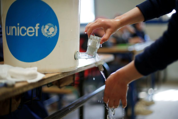 A Syrian refugee student takes part in a washing hands activity as part of an awareness campaign about coronavirus initiated by OXFAM and UNICEF at Al Zaatari refugee camp