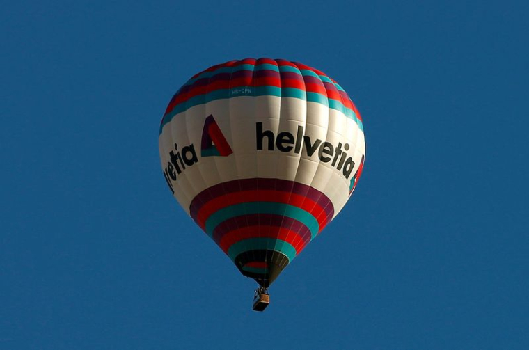 FILE PHOTO: The logo of Swiss Helvetia Insurance is seen on a hot air ballon floating near Romanshorn