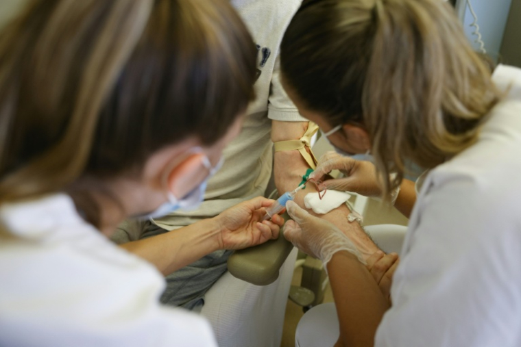 Travailler le 1er mai n'est actuellement autorisé que pour certaines activités ne pouvant interrompre le travail comme les hôpitaux, hôtels ou encore usines dont les machines tournent en continu ( AFP / Geoffroy Van der Hasselt )