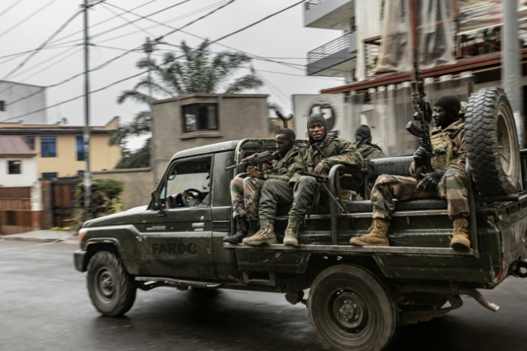 Des membres du groupe armé M23 patrouillent dans une rue de Goma, en République démocratique du Congo, le 29 janvier 2025 ( AFP / - )