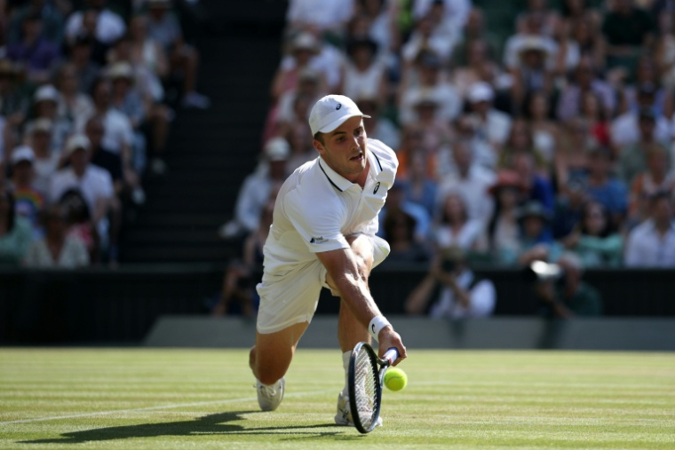 Le Britannique Arthur Féry en quarts de finale de Wimbledon contre l'Italien Flavio Cobolli le 8 juillet 2026 à Londres ( AFP / Henry NICHOLLS )