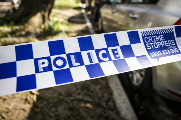 Un tireur a semé la panique en ouvrant le feu à plusieurs dizaines de reprises dimanche soir dans une rue commerçante très fréquentée de Sydney, faisant 16 blessés ( AFP / DAVID GRAY )
